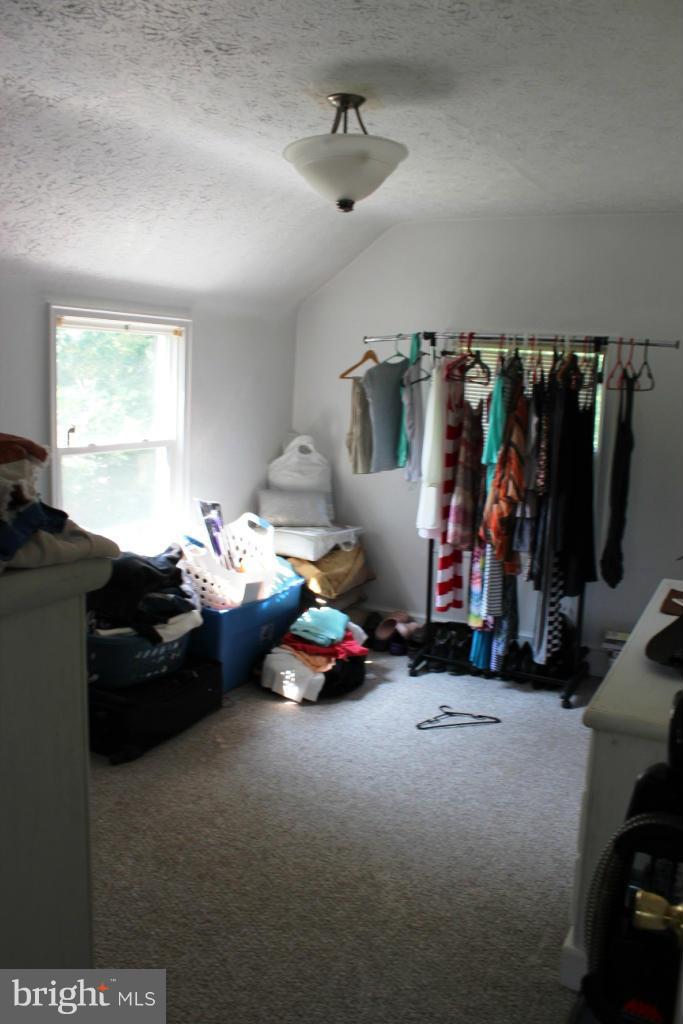 46695 Yorktown Road Lexington Park, MD 20653 - Photo 8 of 14 a bedroom with furniture and a window