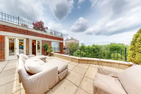 a outdoor living space with furniture and city view