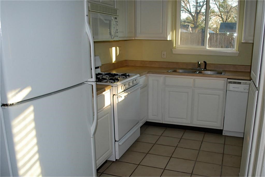 6611 Housman Houston, TX 77055 - Photo 5 of 17 Kitchen has young gas range and dishwasher. Fridge NOT included.