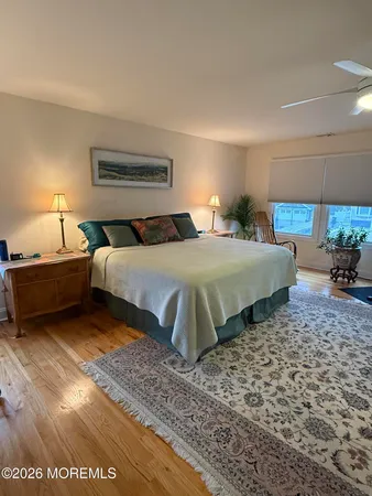a bedroom with a bed and a night stand