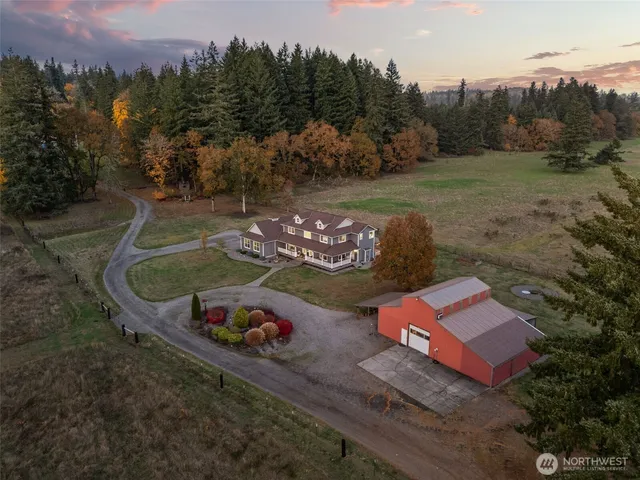 an aerial view of a house having yard