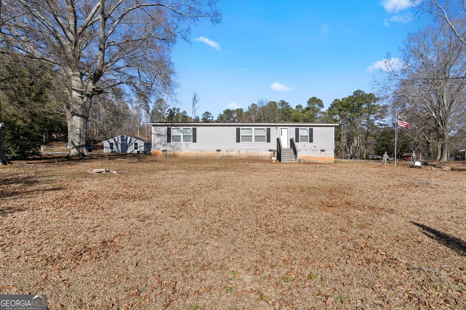 2129 Calhoun Road Northeast Rome, GA 30161 - Photo 1 of 1 a view of large trees with a yard