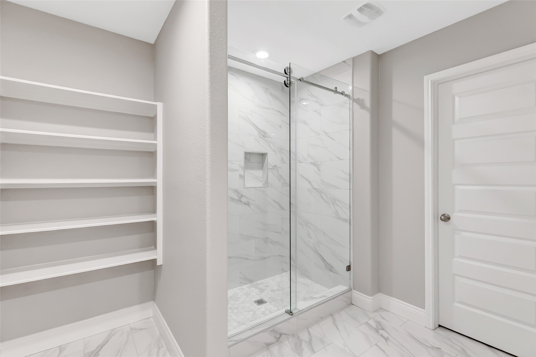 214 Kickapoo Drive Anahuac, TX 77514 - Photo 26 of 36 a bathroom with a shower and a glass door