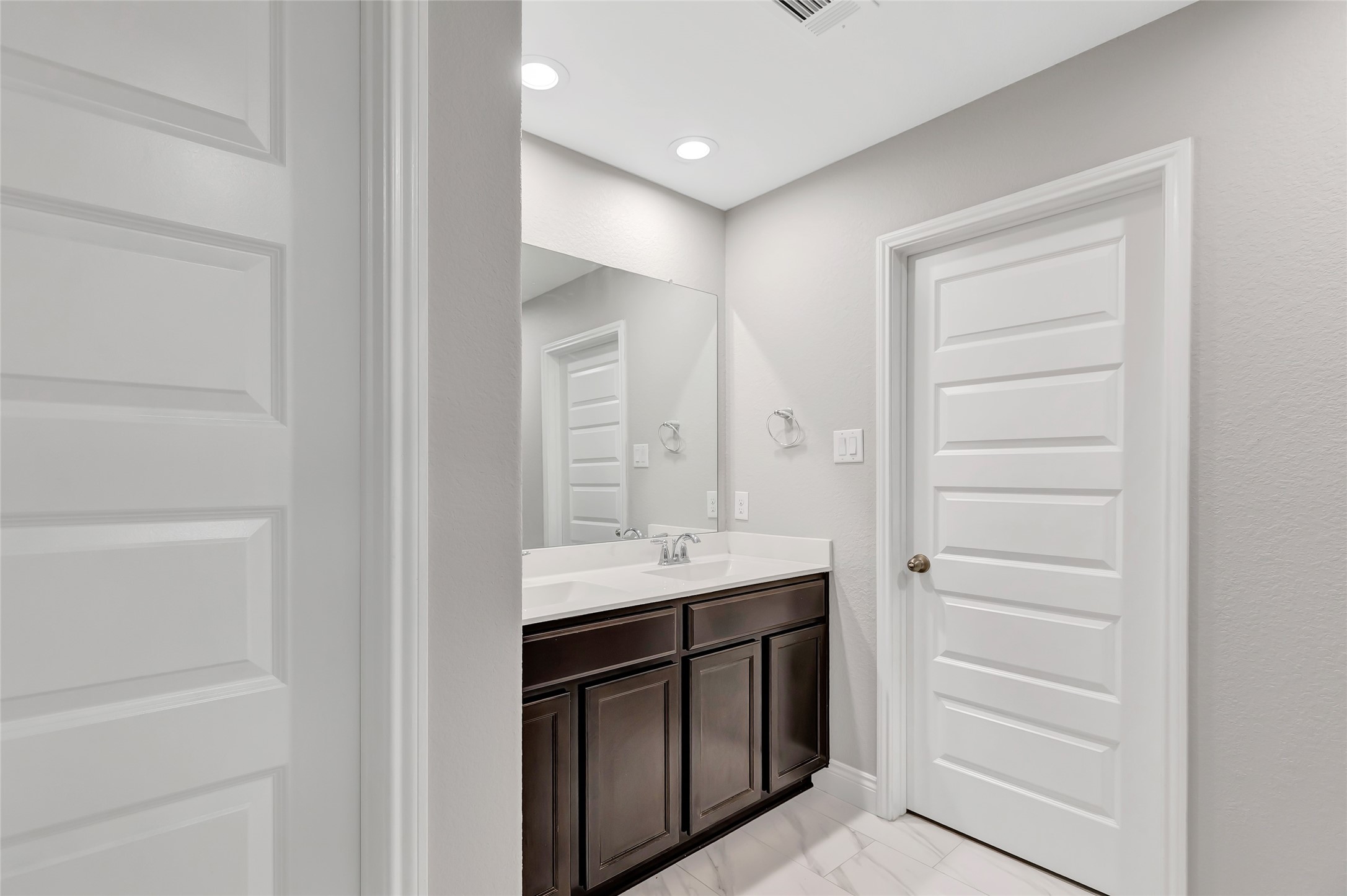 214 Kickapoo Drive Anahuac, TX 77514 - Photo 27 of 36 a bathroom with a sink a vanity and a mirror