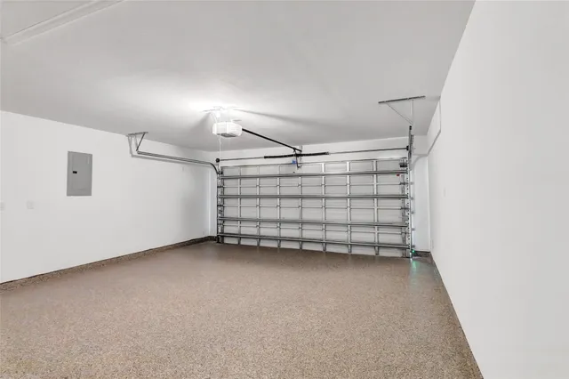 a view of a room with wooden floor and white walls