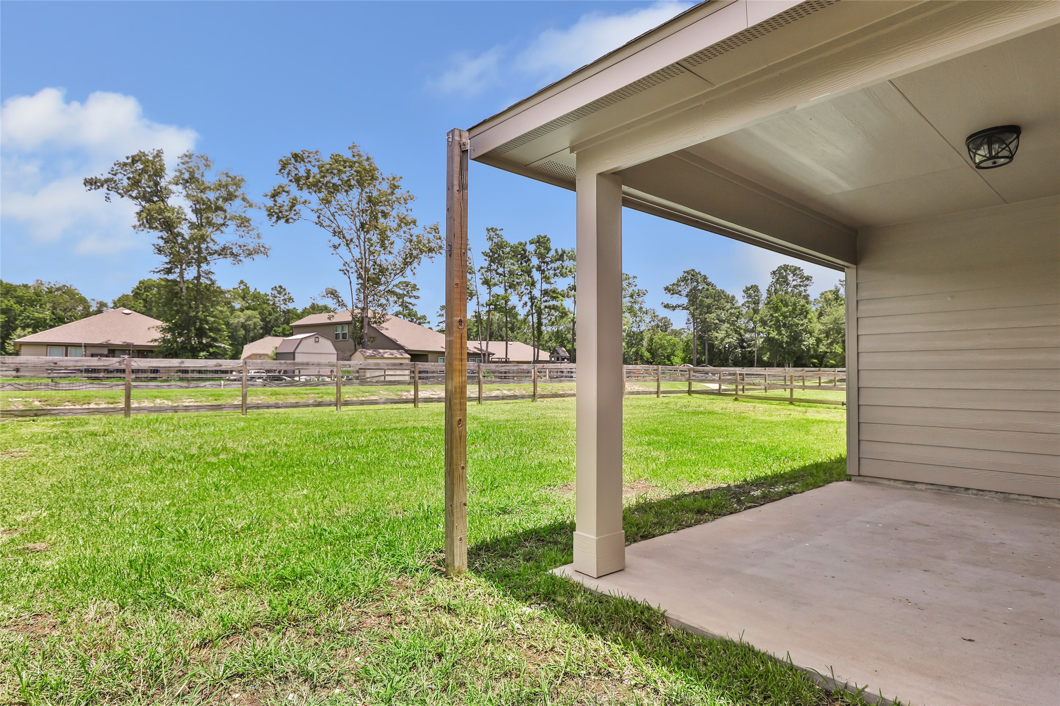 214 Kickapoo Drive Anahuac, TX 77514 - Photo 32 of 36 a view of a backyard with garden