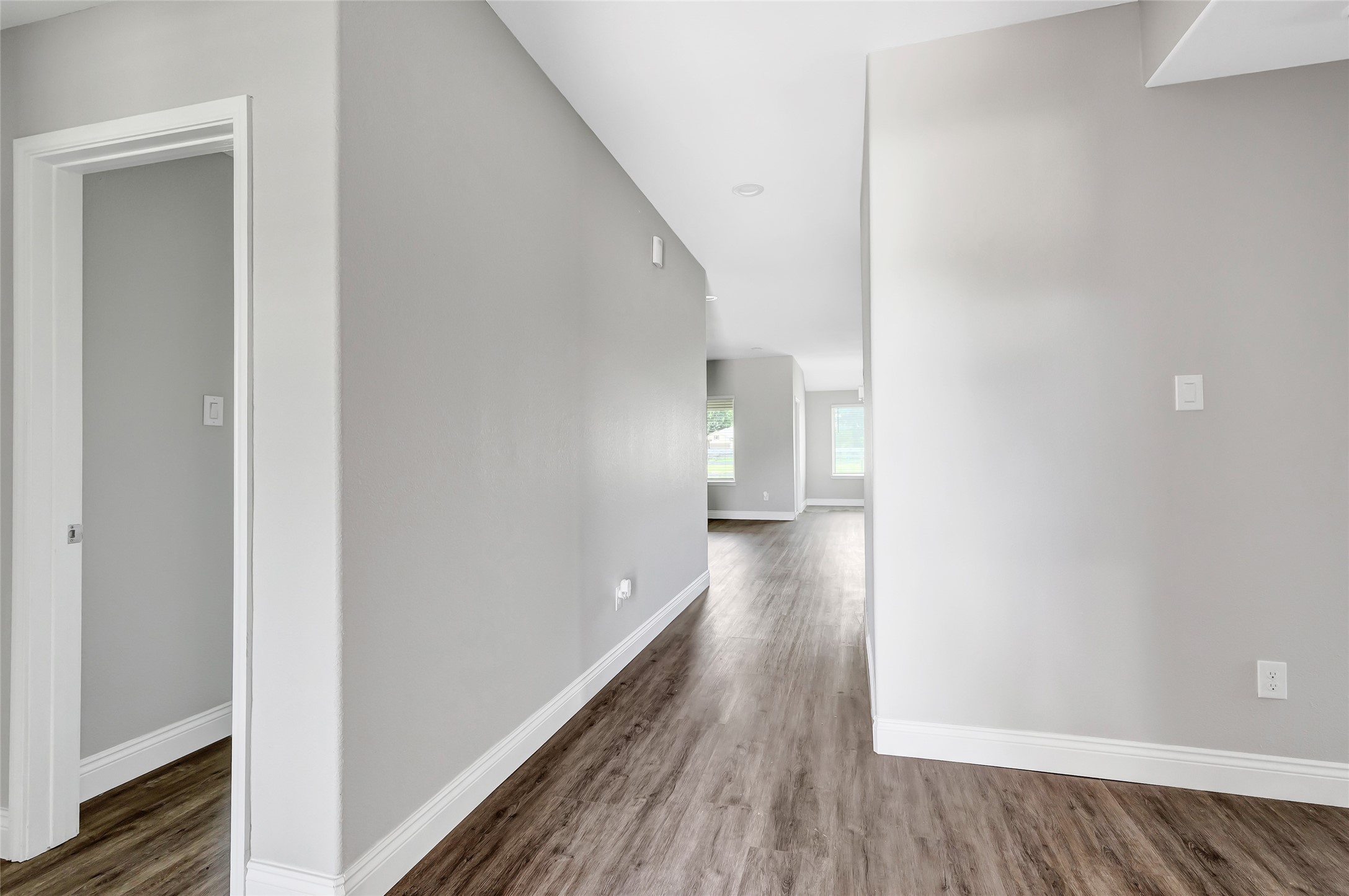 214 Kickapoo Drive Anahuac, TX 77514 - Photo 5 of 36 a view of a hallway with wooden floor