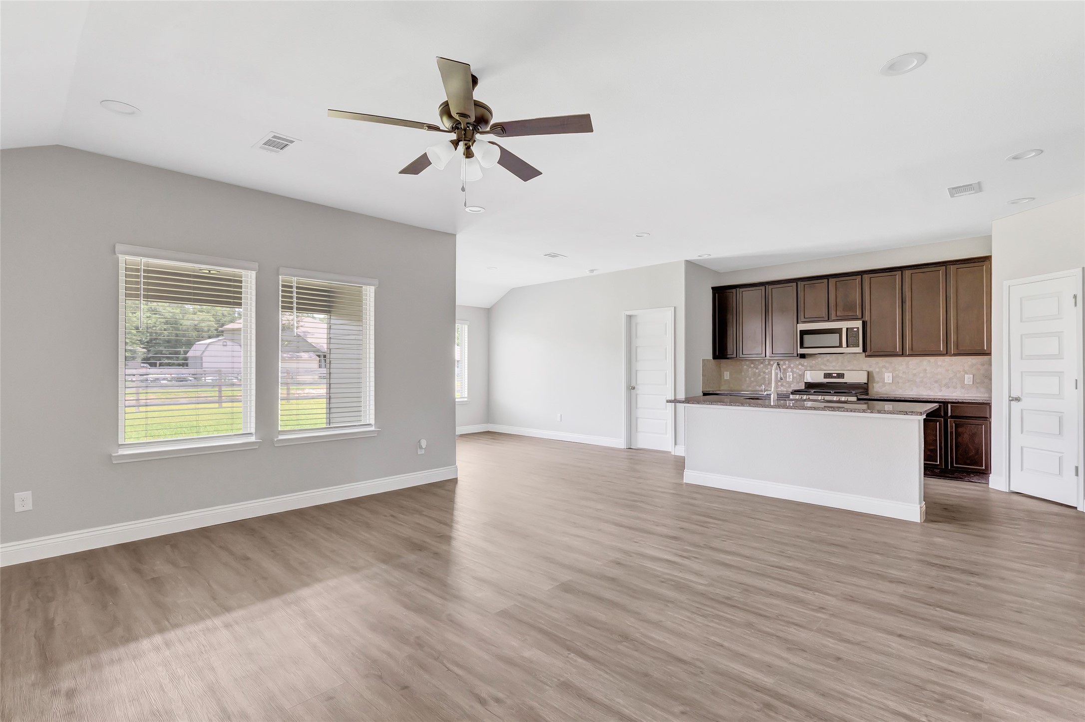 214 Kickapoo Drive Anahuac, TX 77514 - Photo 36 of 36 a view of kitchen with sink microwave and refrigerator