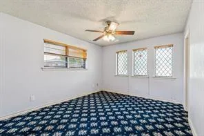 a view of a bedroom with wooden floor