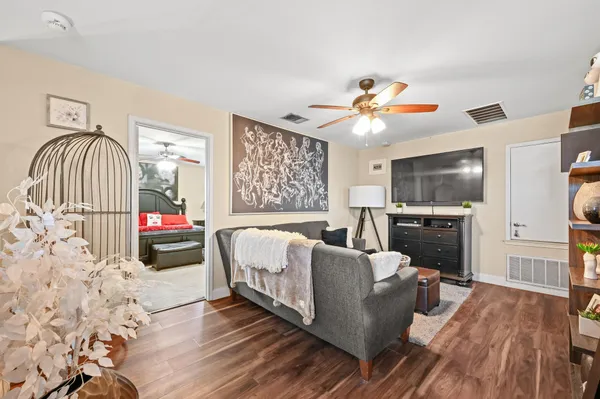 a living room with furniture fireplace and flat screen tv