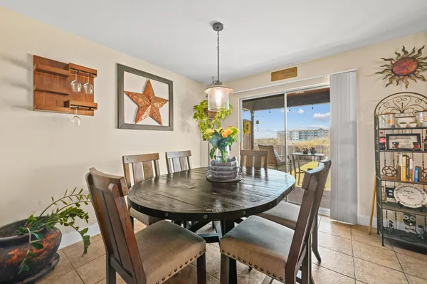 a dining room with furniture and window