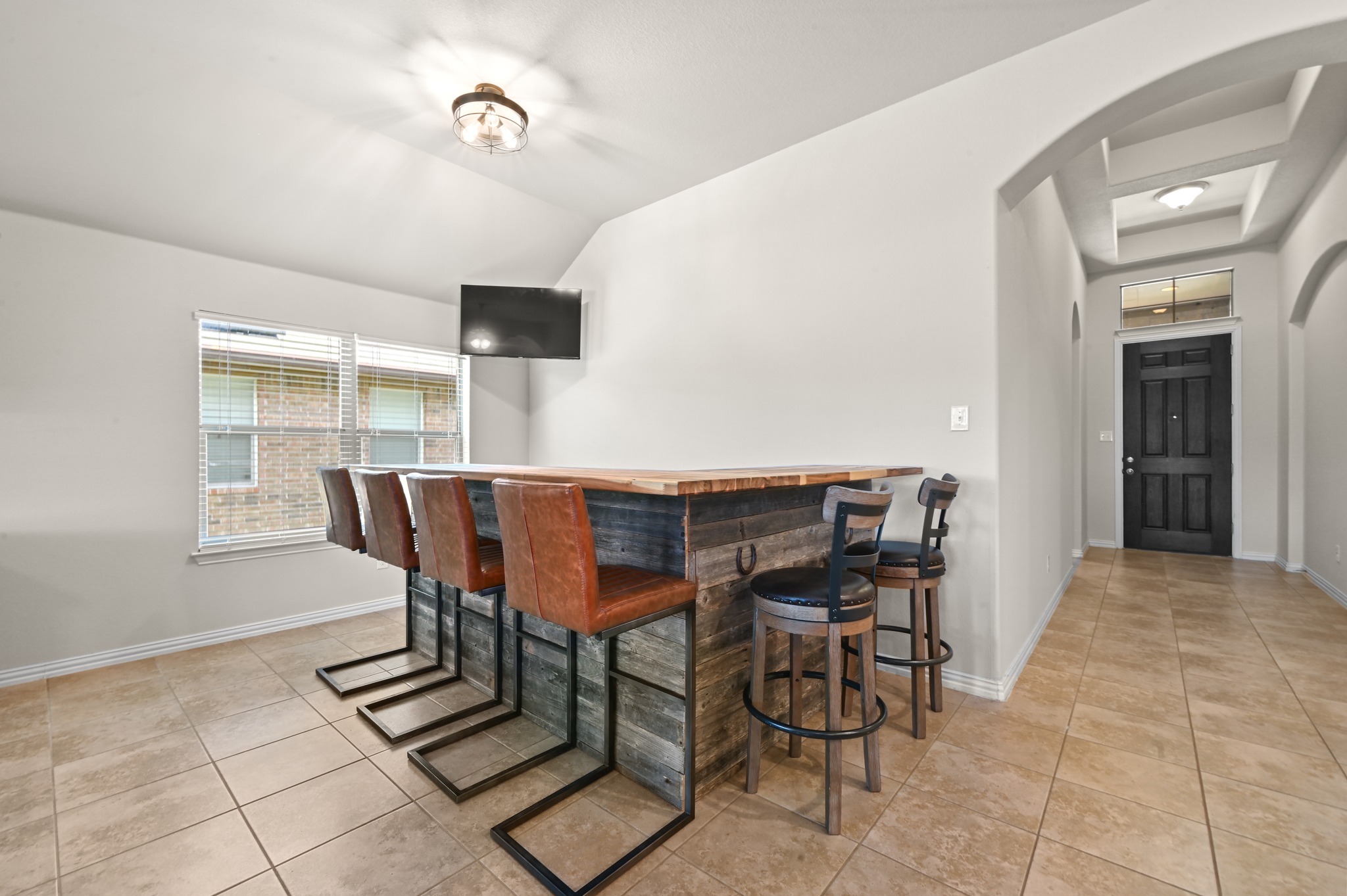 877 Hot Spring Valley Buda, TX 78610 - Photo 14 of 36 a view of a dining room with furniture and chandelier