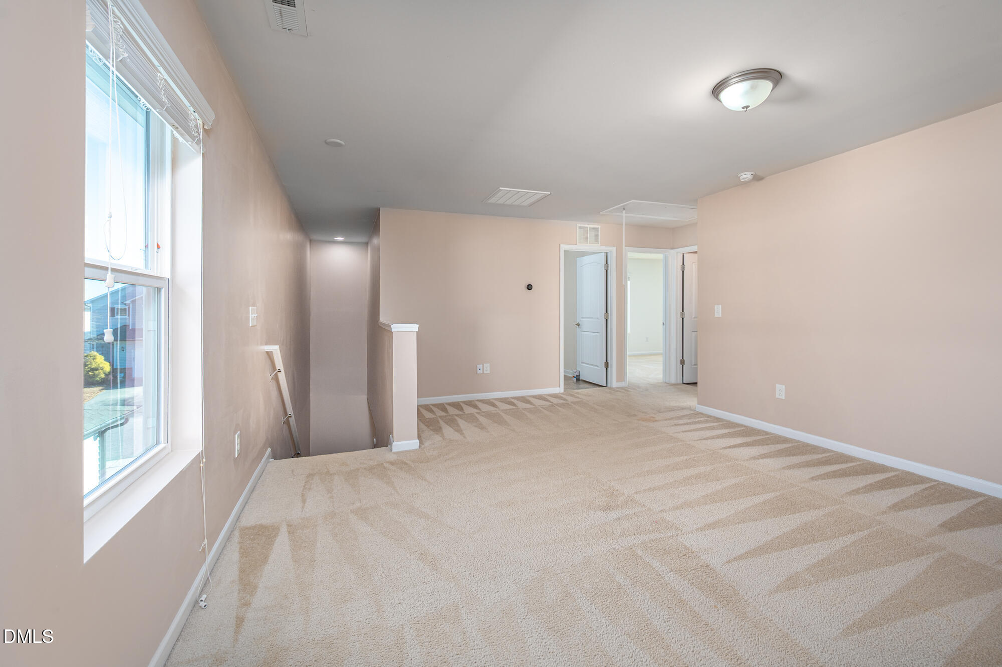 3548 Althorp Drive Raleigh, NC 27616 - Photo 20 of 56 a view of a big room with windows and chandelier fan
