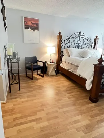 a bedroom with a bed and a table in it