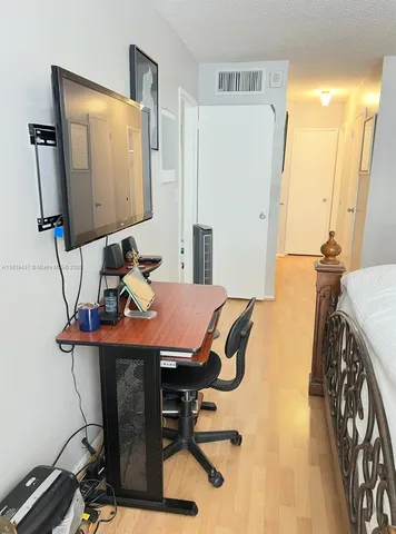 a view of a workspace with furniture