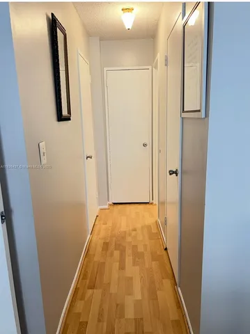 a bathroom with a sink a toilet a shower a mirror and vanity