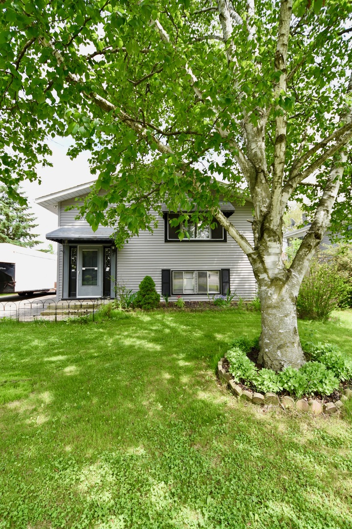 13 Tweed Road Fox Lake, IL 60020 - Photo 2 of 23 a view of a house with a yard