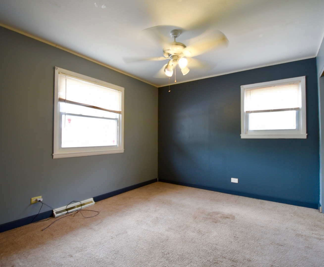 13 Tweed Road Fox Lake, IL 60020 - Photo 14 of 23 an empty room with windows and chandelier fan