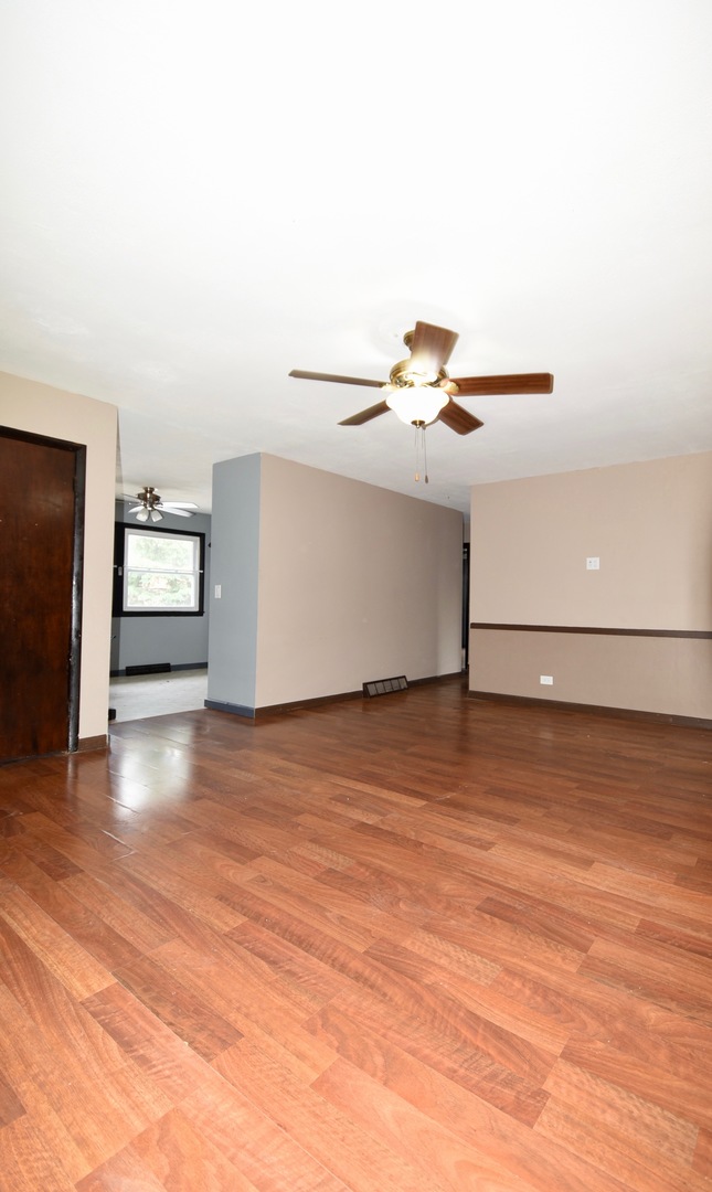 13 Tweed Road Fox Lake, IL 60020 - Photo 4 of 23 a view of a room with wooden floor