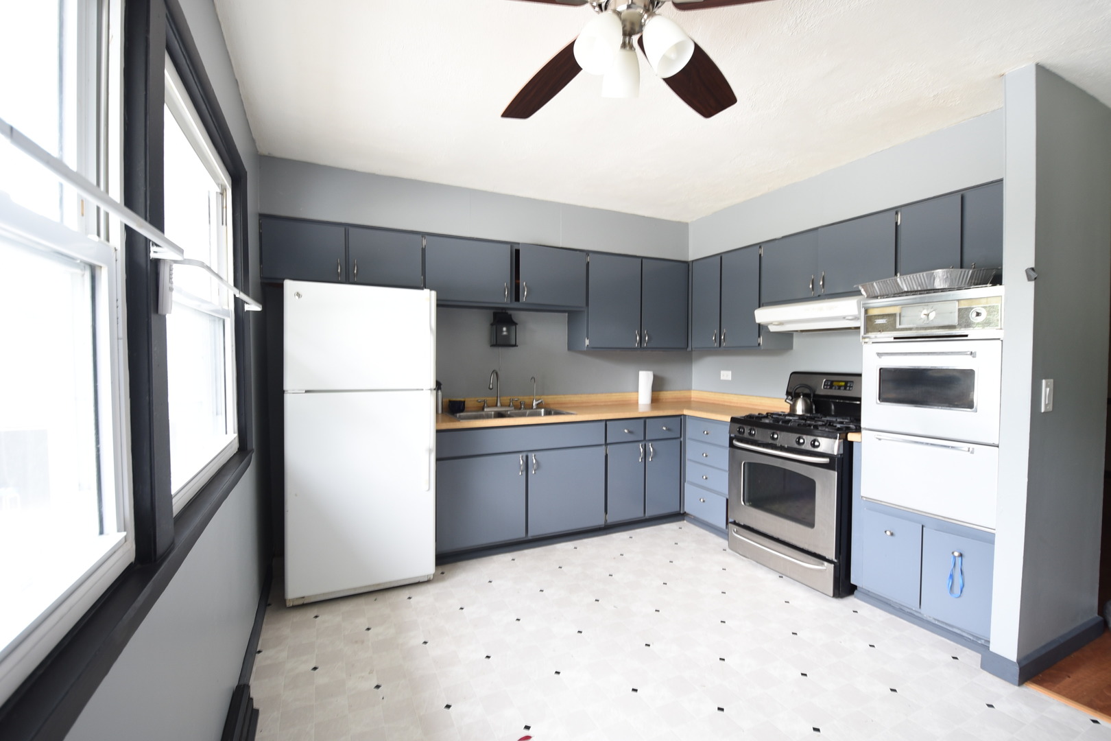 13 Tweed Road Fox Lake, IL 60020 - Photo 6 of 23 a kitchen with stainless steel appliances kitchen island a refrigerator sink and stove
