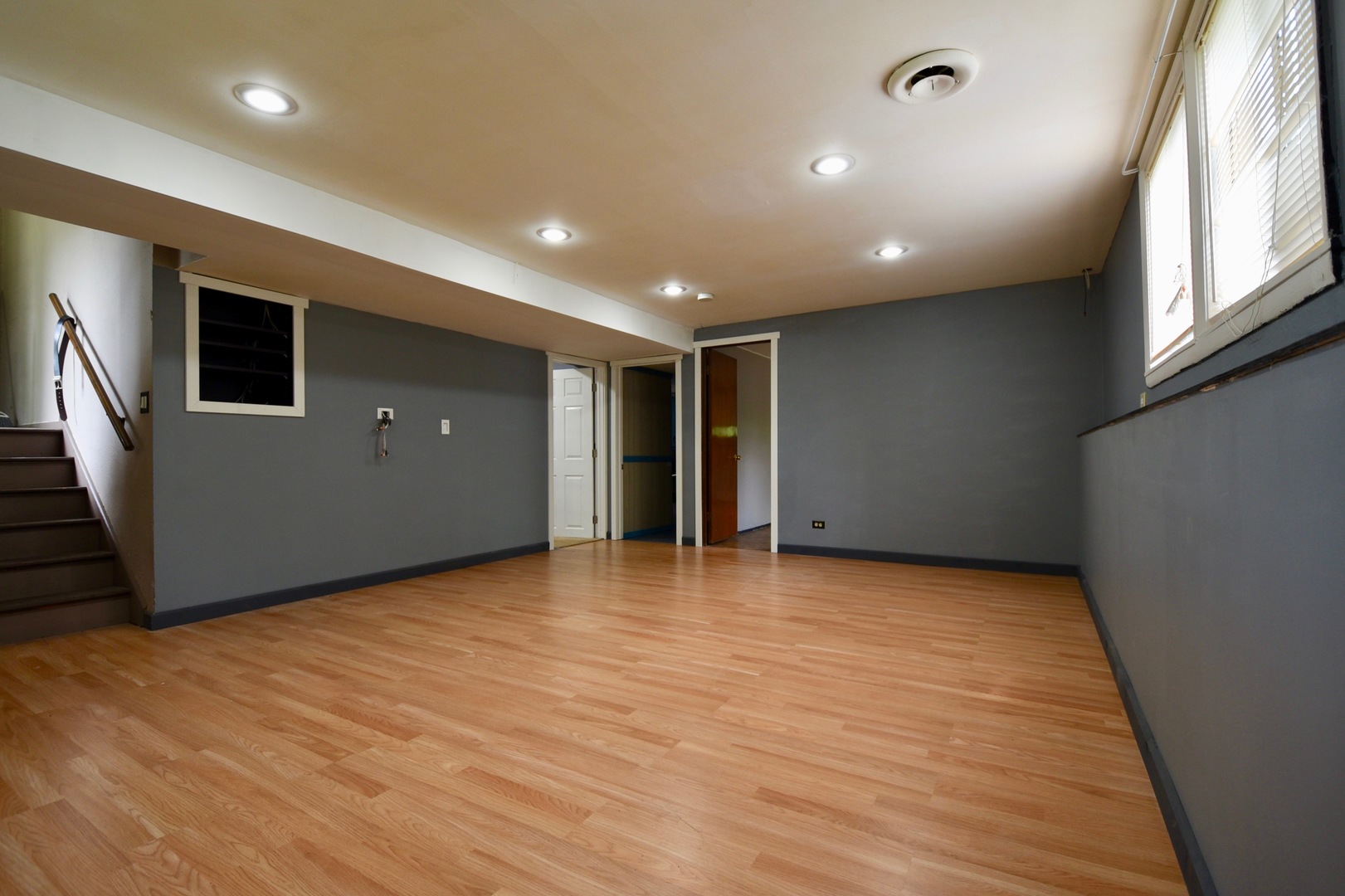13 Tweed Road Fox Lake, IL 60020 - Photo 8 of 23 an empty room with wooden floor and windows