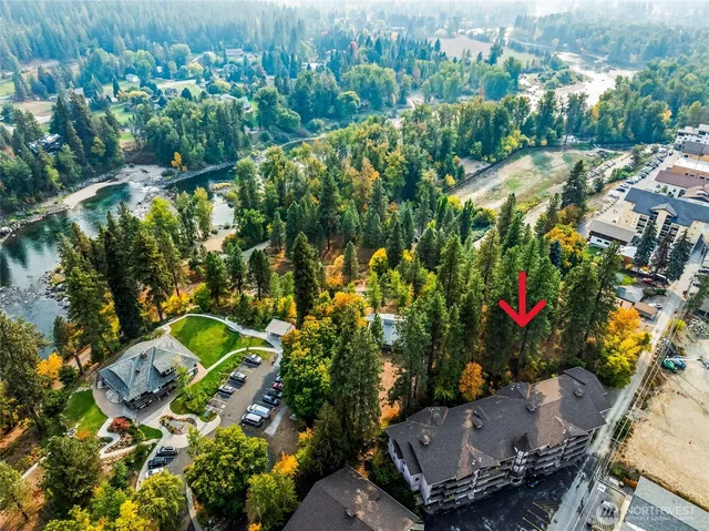 an aerial view of residential house with outdoor space and swimming pool