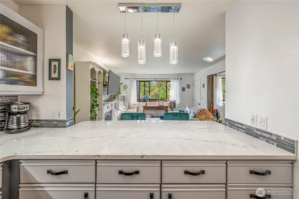 a view of living room and kitchen