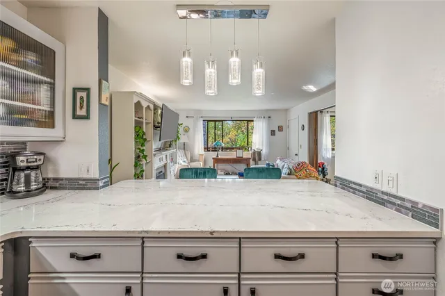 a view of living room and kitchen