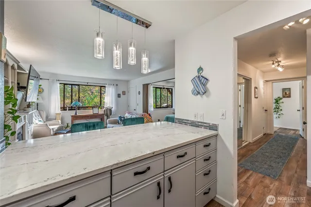 a living room with fireplace furniture and a flat screen tv
