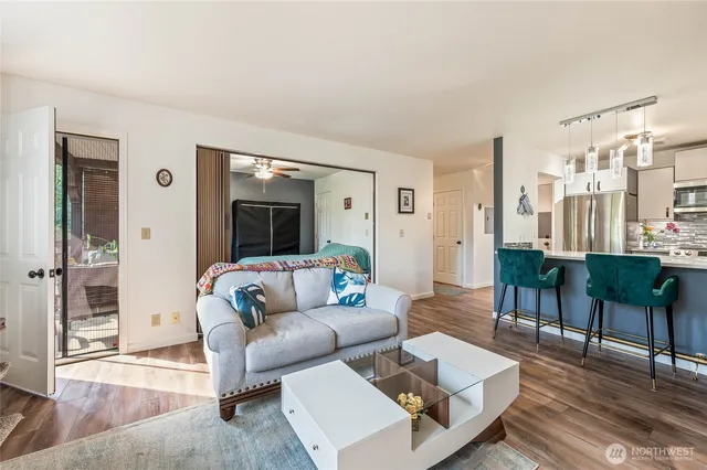 a living room with furniture and a large window