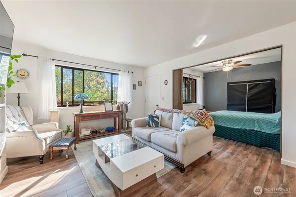 a bedroom with a bed and ceiling fan