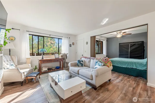 a bedroom with a bed and ceiling fan