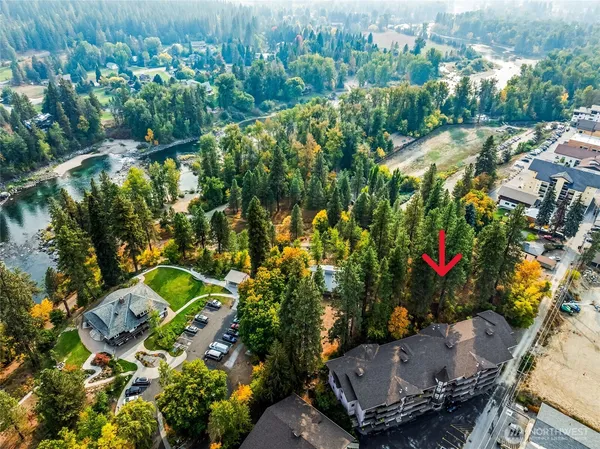 an aerial view of residential house with outdoor space and swimming pool