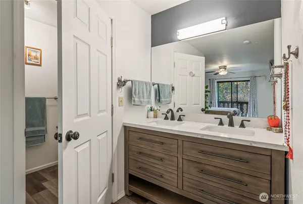 a bathroom with a glass shower door
