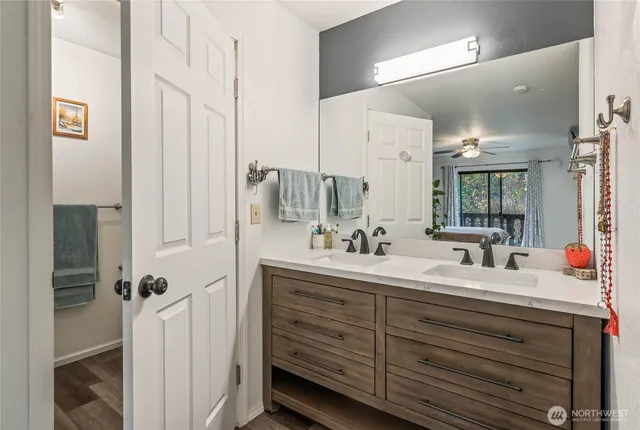 a bathroom with a glass shower door