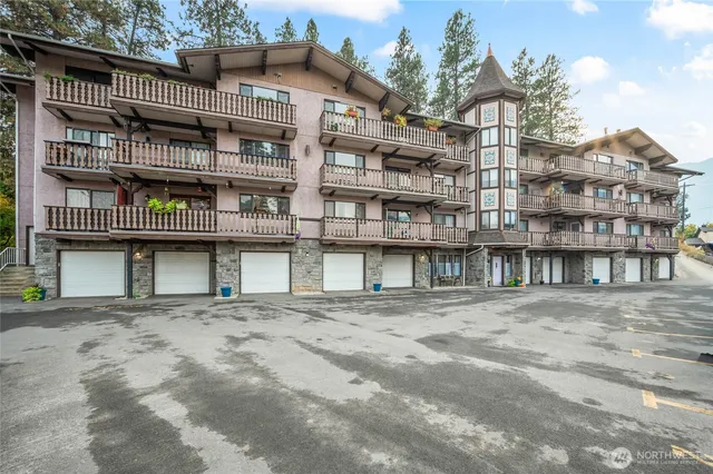 a kitchen with stainless steel appliances granite countertop a sink stove microwave and cabinets