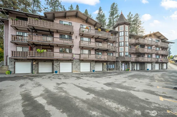a kitchen with stainless steel appliances granite countertop a sink stove microwave and cabinets