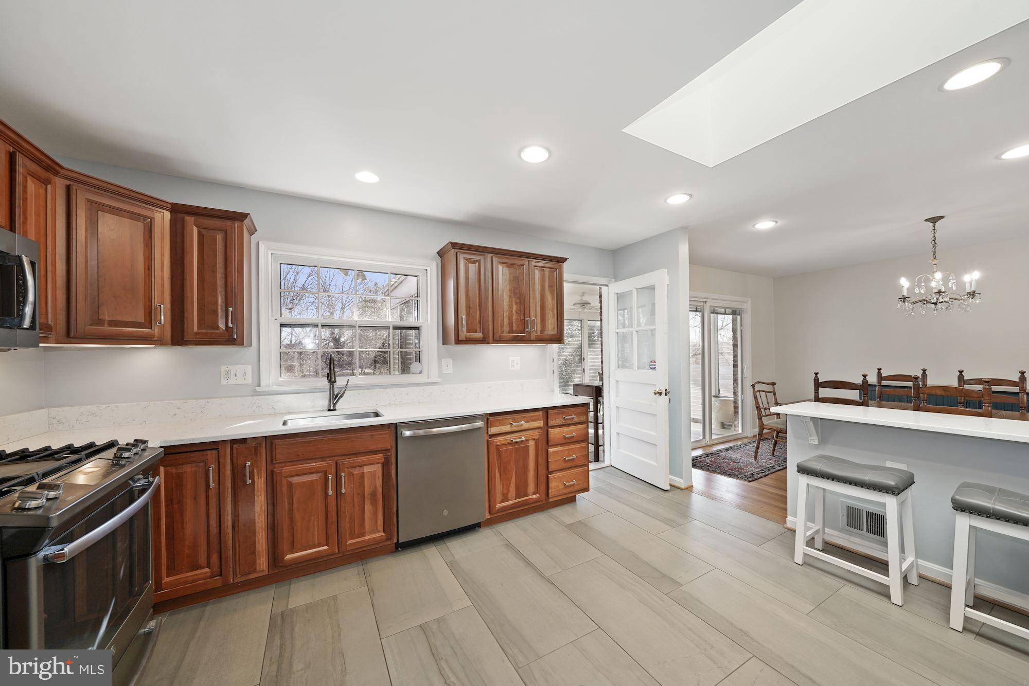 9709 Byeforde Road Kensington, MD 20895 - Photo 10 of 35 Kitchen opening to Rear 3 Season Porch