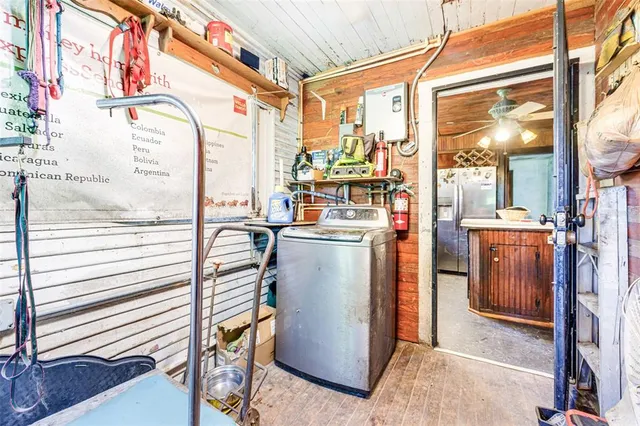 a view of a living room with furniture and a garage