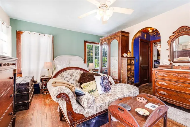 a living room with furniture and entry gate