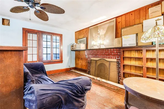 a bedroom with a bed and a fireplace