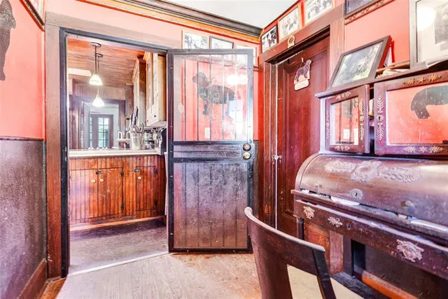 a living room with furniture and a dresser