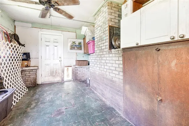 a view of backyard with wooden fence