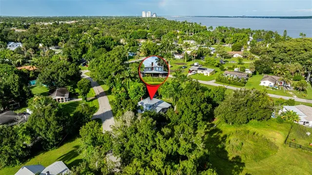 a backyard of a house with lots of green space and trees