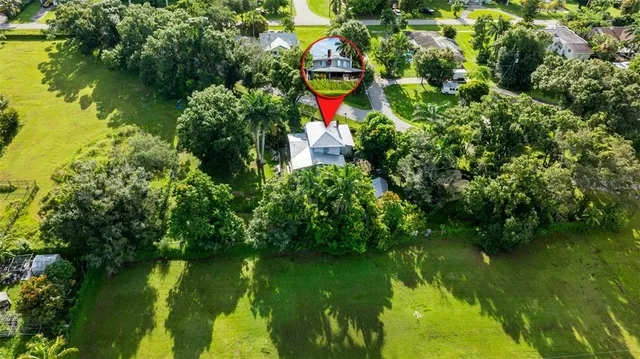 a view of field with trees in the background