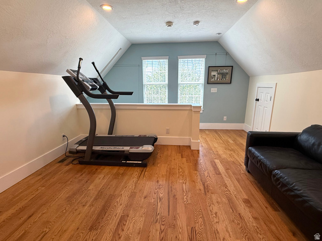 776 Canyon Road Hyde Park, UT 84318 - Photo 20 of 57 Attic space featuring wood-finish flooring, recessed lighting, and sloped ceilings