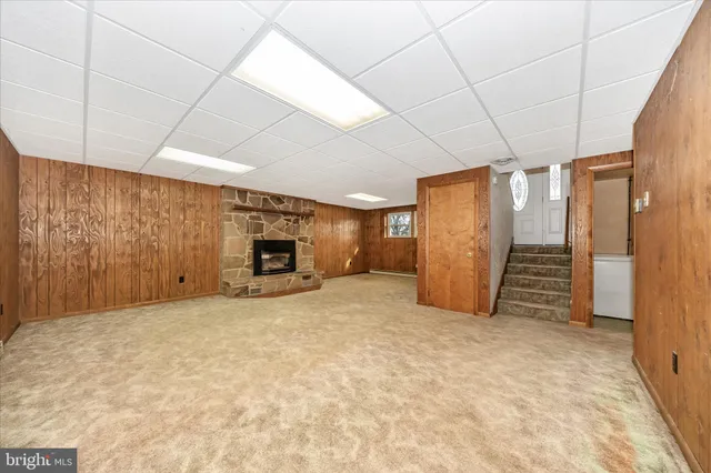 a view of an empty room with fireplace