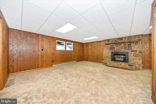 a view of an empty room with a fireplace