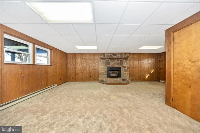 a view of an empty room with a fireplace
