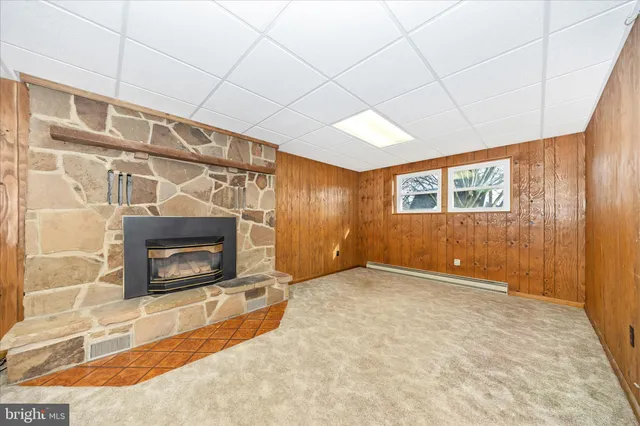 a view of an empty room with a fireplace